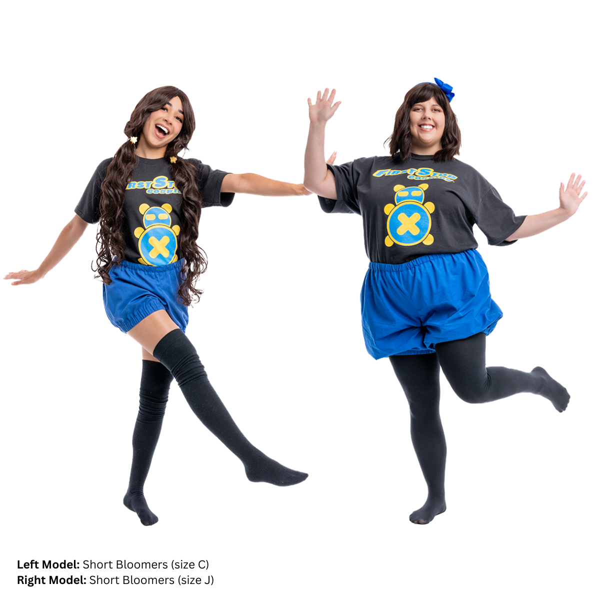 Two female models wearing the Short Bloomers. The model on the left (Size C) has one leg kicked forward, displaying the elastic leg openings. The model on the right (size J) is facing the camera and smiling with her hands out.