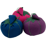 Image of three Dritz Tomato Pin Cushions. From left to right, the colors are: blue, hot pink, and purple.