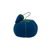 Image of the blue Dritz Tomato Pin Cushion. The emery strawberry sits atop the pin cushion.
