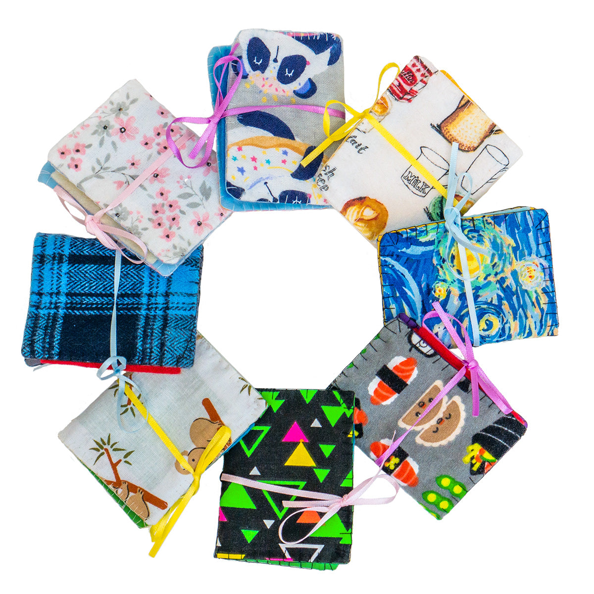 A circular array of eight different completed Needle Books. From the top and going clockwise: Panda fabric, Cafe Latte fabric, Starry Night fabric, Sushi fabric, Retro fabric, Koala fabric, Plaid fabric, and Floral fabric.