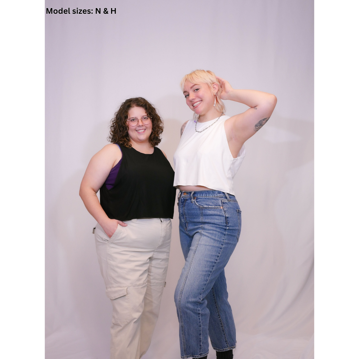 A photo of 2 people. One wearing a black sleeveless crop top (Size N) with beige pants, and the other wearing a sleeveless crop top (size H) with jeans.