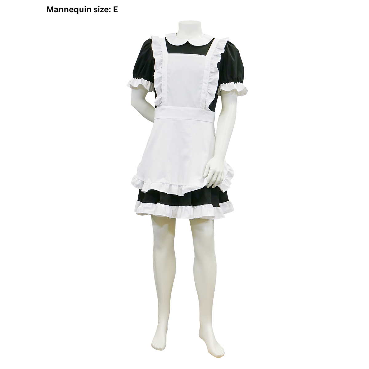 A completed FSCO Maid Outfit (m) on  a male mannequin in size E. The garment consists of a black dress with white ruffle and apron. The neckline of the apron is square and the silhouette of both is A-line.