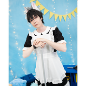 Male model, matthew_aizel (size E) posing in the completed Maid Outfit (men's) with apron included. His hands are propped on a broom handle.