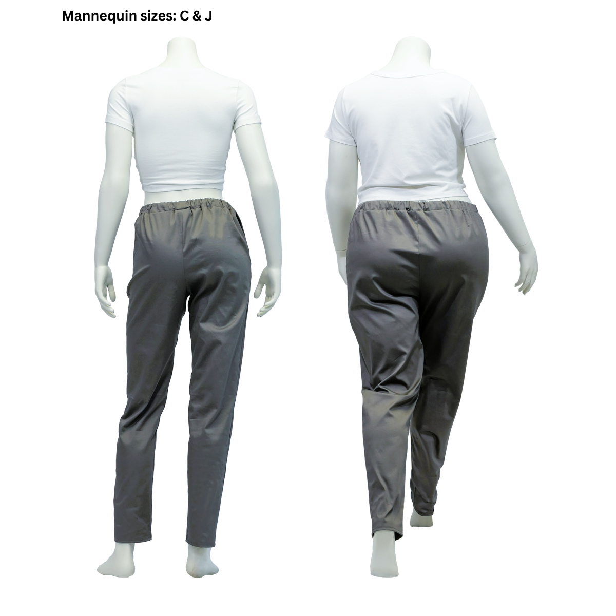 The reverse side of two completed FSCO Pants (f) on female mannequins in sizes C and J. Because of the way the mannequins are posed, it is easy to tell the relaxed, tapered fit of the pants.