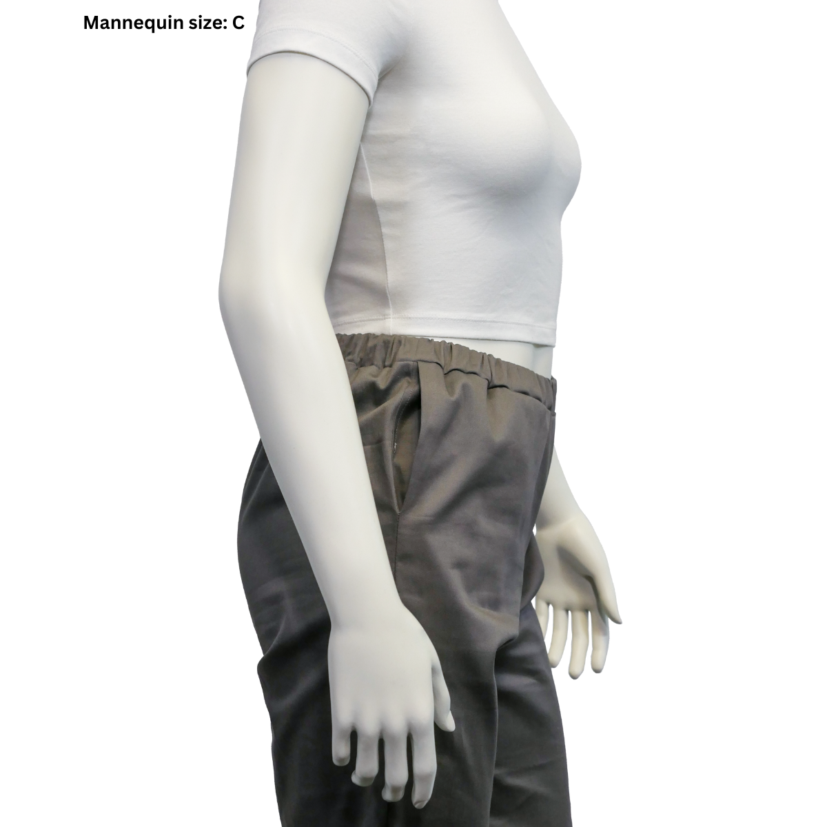 A zoomed-in view of the profile of the size C mannequin wearing completed Pants. The pocket has been pushed opened for easy viewing.
