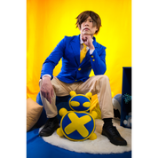 Male model (size E) sitting on a stool and posing in the Pants (men's) and blazer.