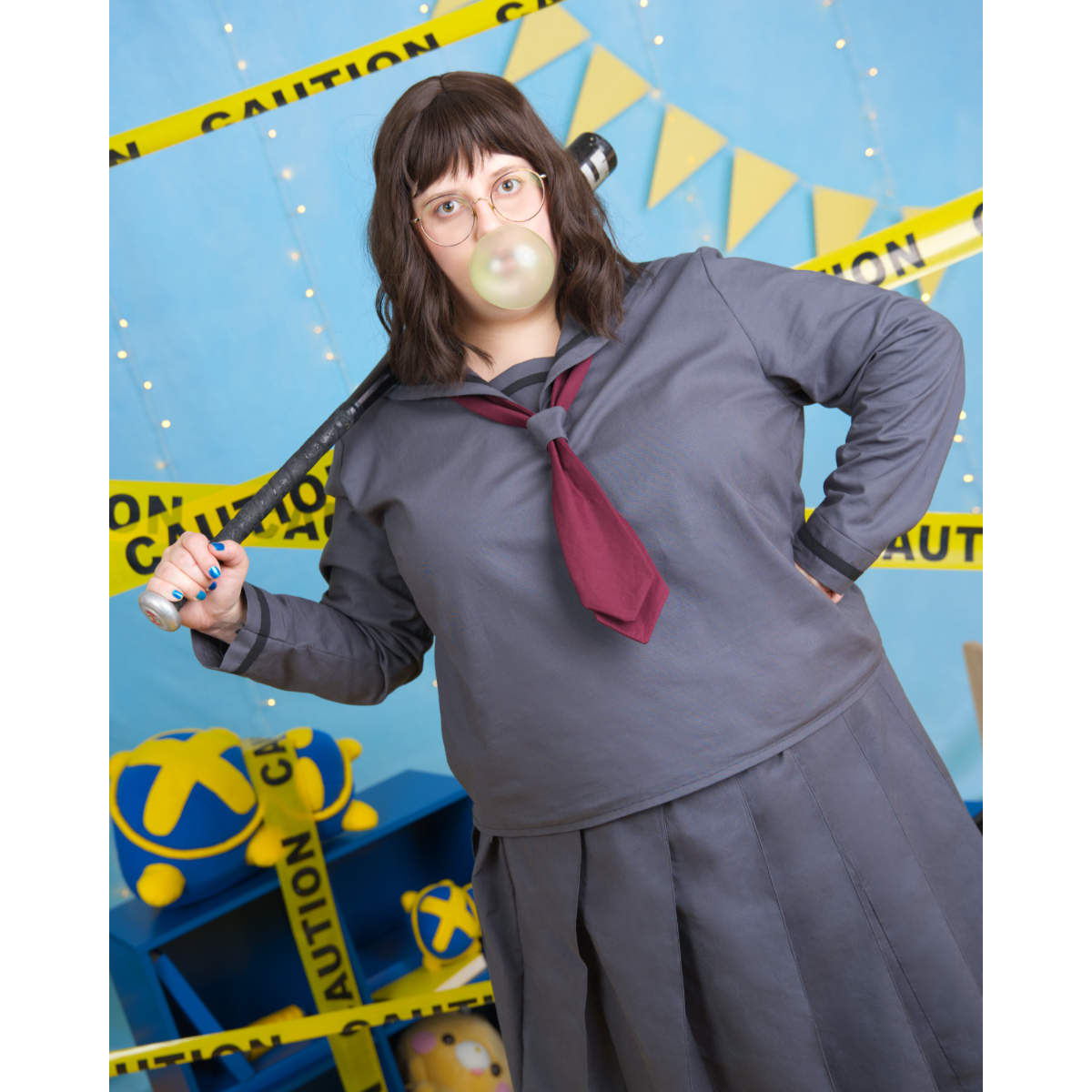 Female plus size model (size J) posing in gray long sleeve Sailor Blouse with a maroon tied scarf.
