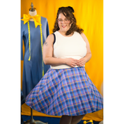 Female model (size J) spinning in the shorter-length Circle Skirt. The skirt flares out from the body as she twirls.