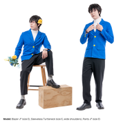 Male model, matthew_aizel (size E), in various poses while wearing a blue Blazer (men's). On the left, he is sitting on a chair with his arm on his knee. On the right, he's standing and adjusting the blazer's collar.
