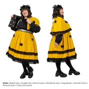 Size J model posing in different stylings of the Capelet. On the left, the model holds the Capelet, unclasped, out to the side- showing how the lining is a different color than the exterior. Ont he right, the model is profile to the camera, showing the draping of the Capelet.