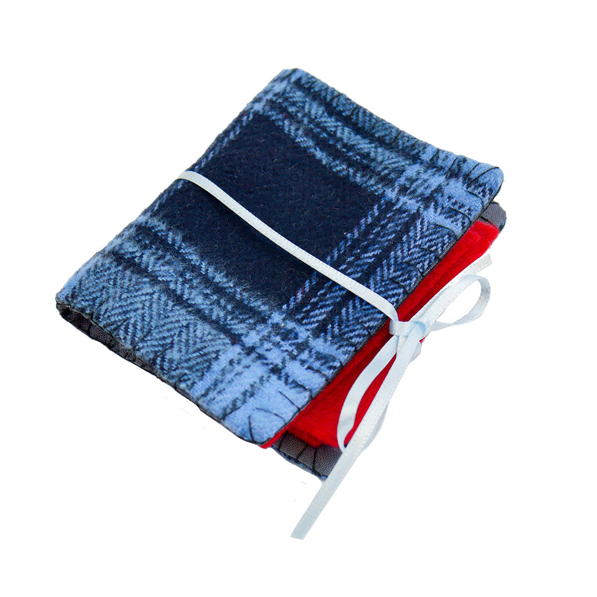 A single completed Needle Book with blue plaid patterned fabric on the outside, red felt pages on the inside, and a thin blue ribbon tying it closed around with a bow.