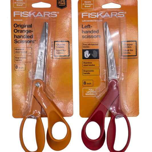 Right- and left-handed scissors in respective packaging.