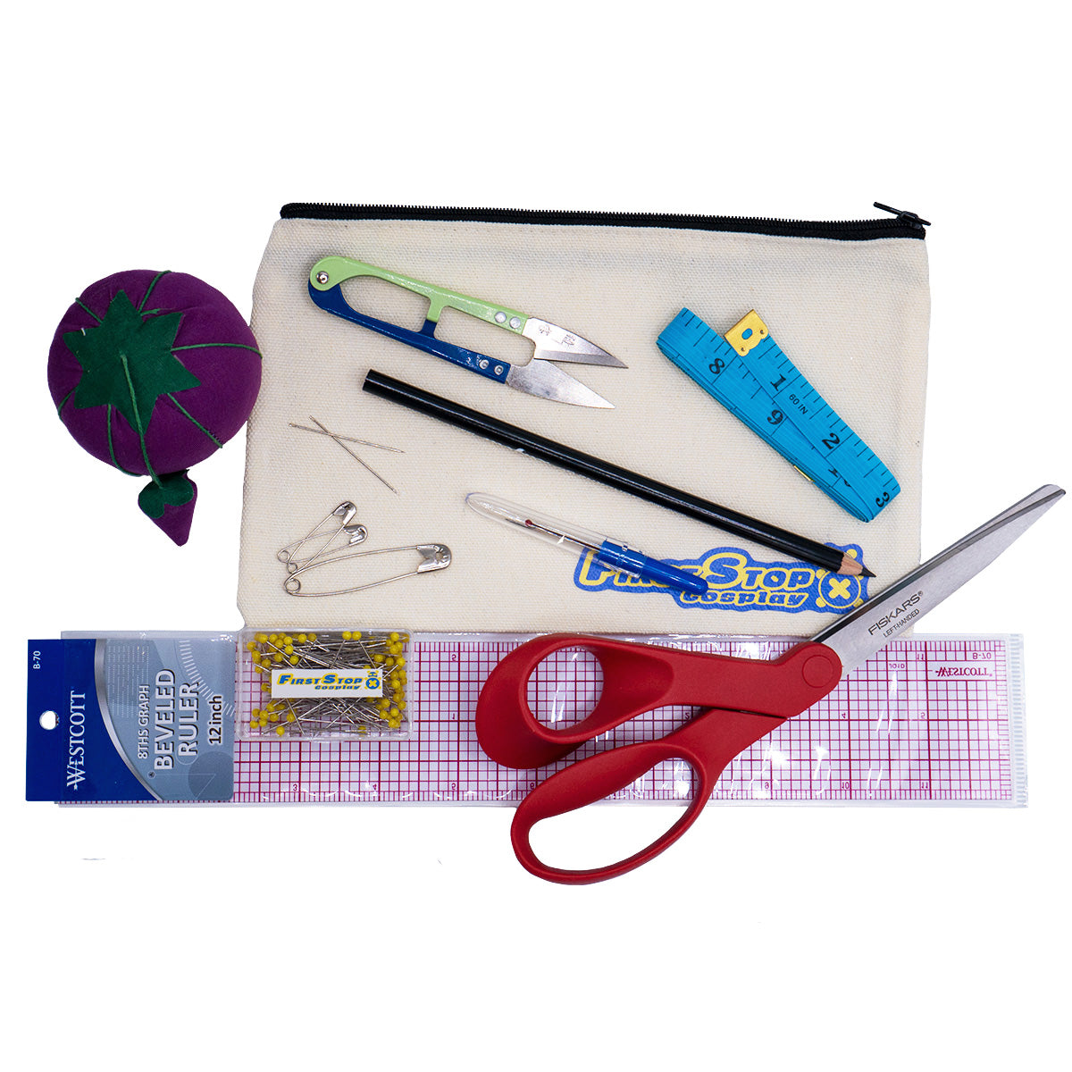 Components of the starter tool set, including a pin cushion, thread clipper, measuring tape, pencil, seam ripper, two sewing needles, three safety pins, a 12" ruler, a box of pins, and scissors.