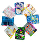 A circular array of eight different completed Needle Books. From the top and going clockwise: Panda fabric, Cafe Latte fabric, Starry Night fabric, Sushi fabric, Retro fabric, Koala fabric, Plaid fabric, and Floral fabric.