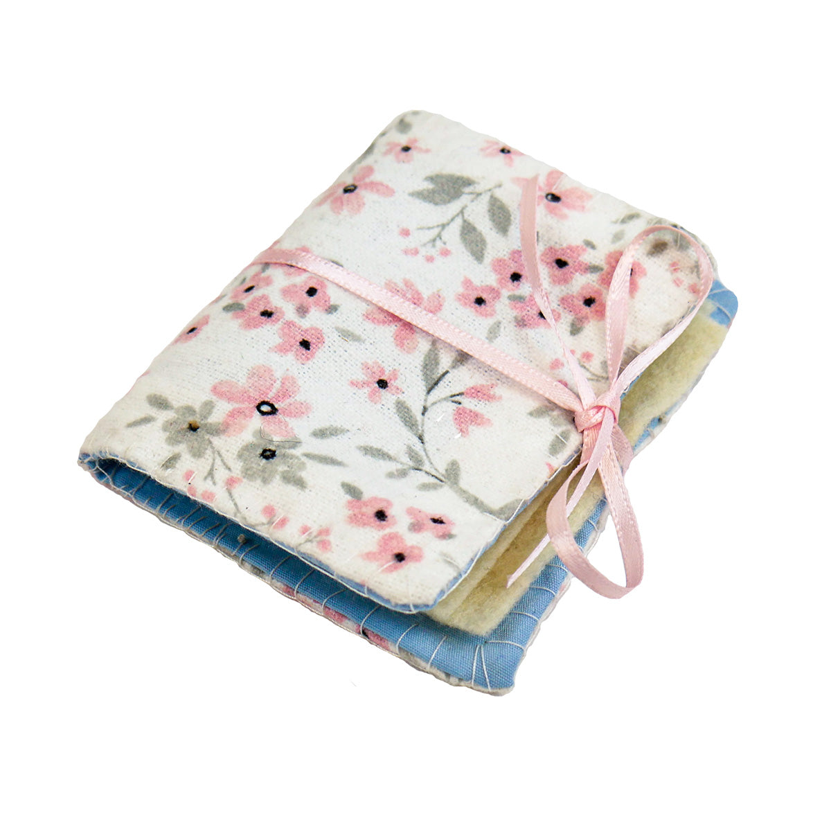 A single completed Needle Book with a pink floral patterned fabric on the outside, yellow felt pages on the inside, and a thin pink ribbon tying it closed around with a bow.