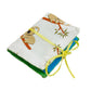 A single completed Needle Book with koalas sitting on tree branches patterned fabric on the outside, bright blue felt pages on the inside, and a thin yellow ribbon tying it closed around with a bow.